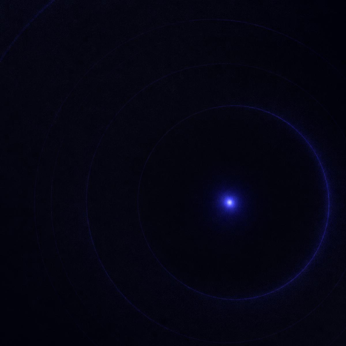 Concentric indigo orbital rings around a single point of light